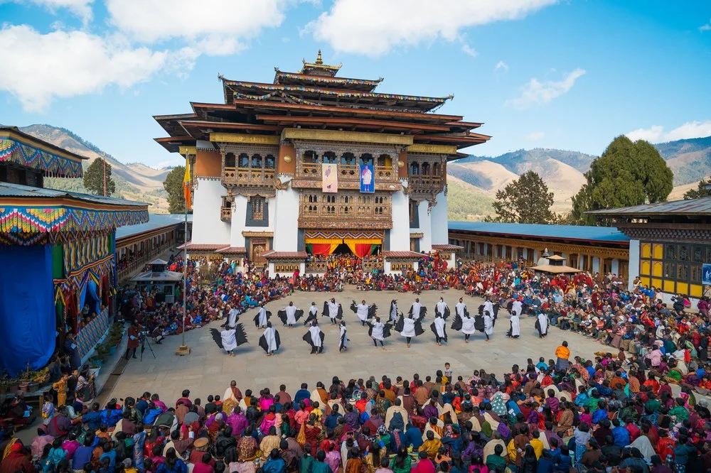 Monks performing sacred Cham mask dance at Paro Tshechu festival Bhutan 2026